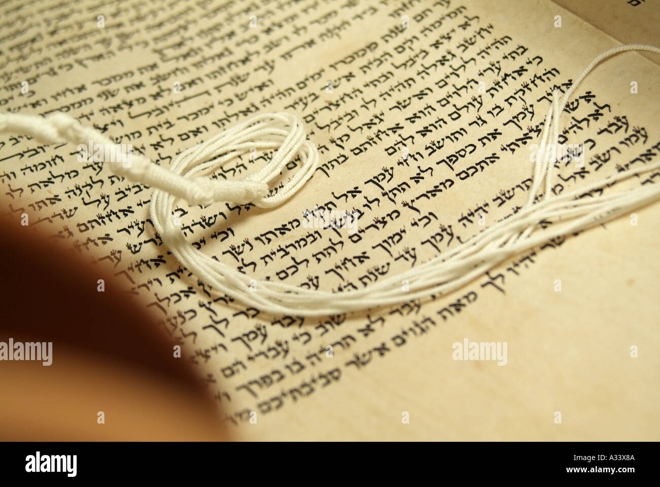 Hebrew Torah Scroll with prayer shawl fridges Stock Photo