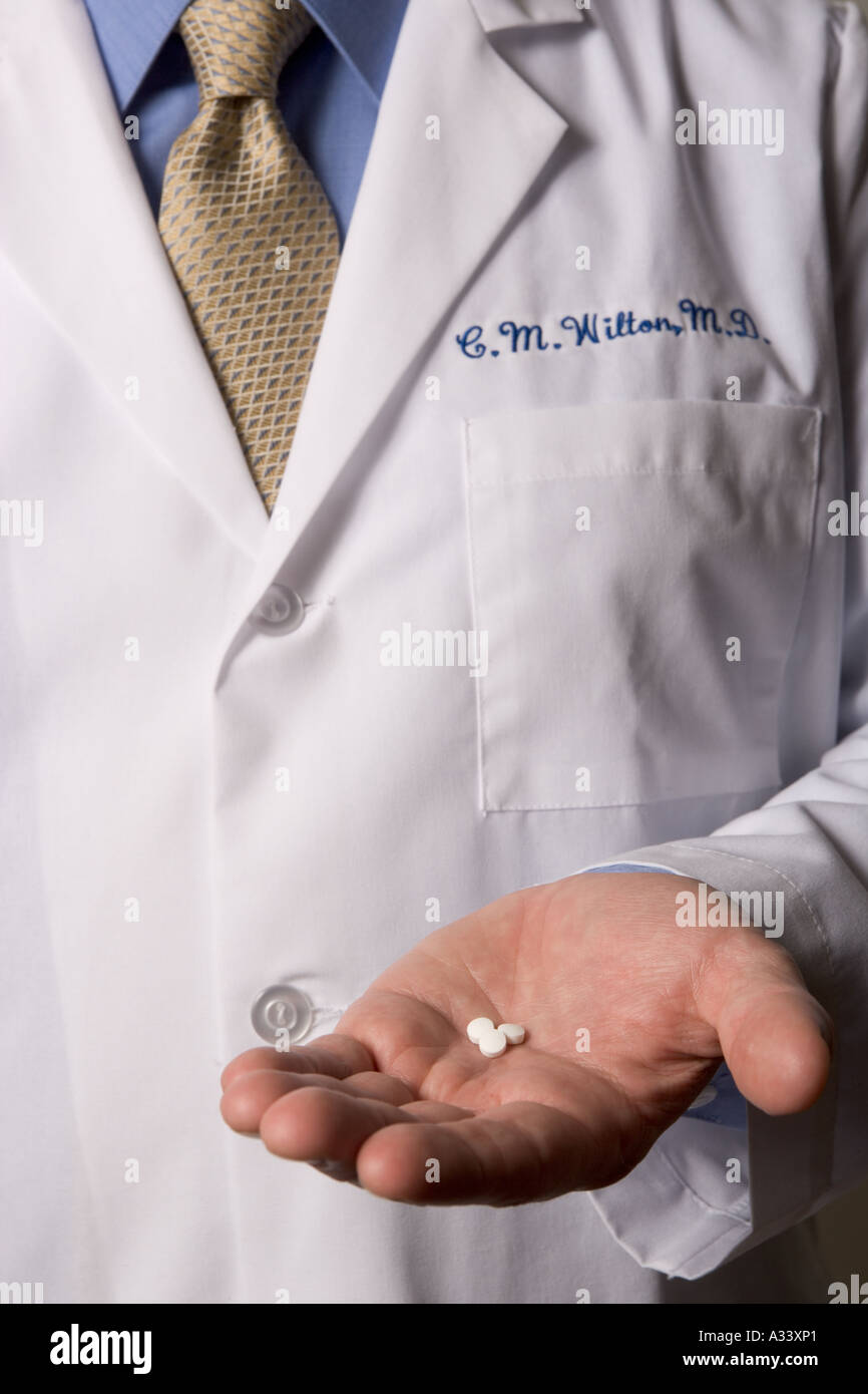 Doctor holding drugs in hand Stock Photo Alamy