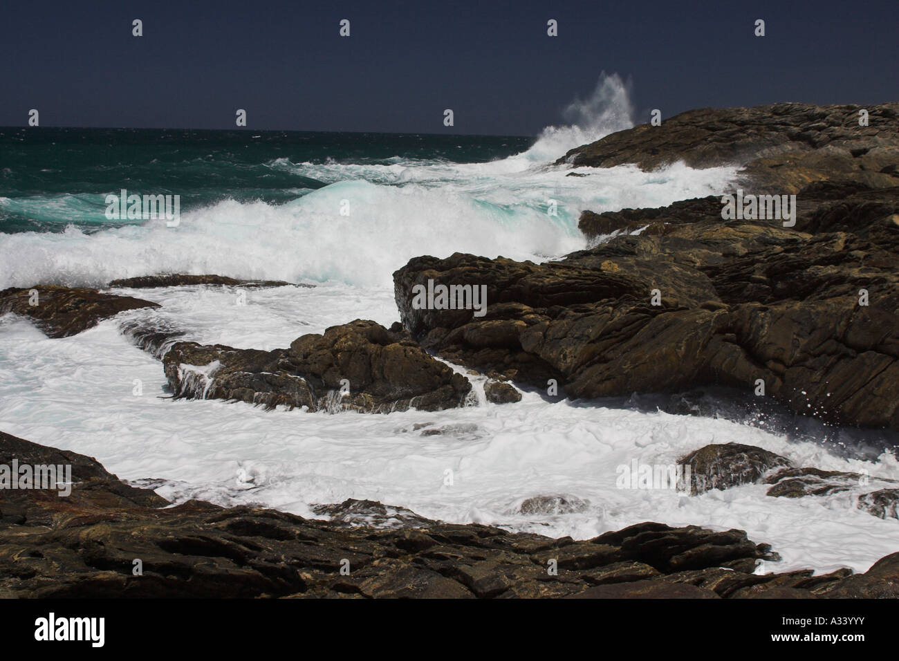 waves crashing over rocks at vivonne bay, kangaroo island, south australia Stock Photo