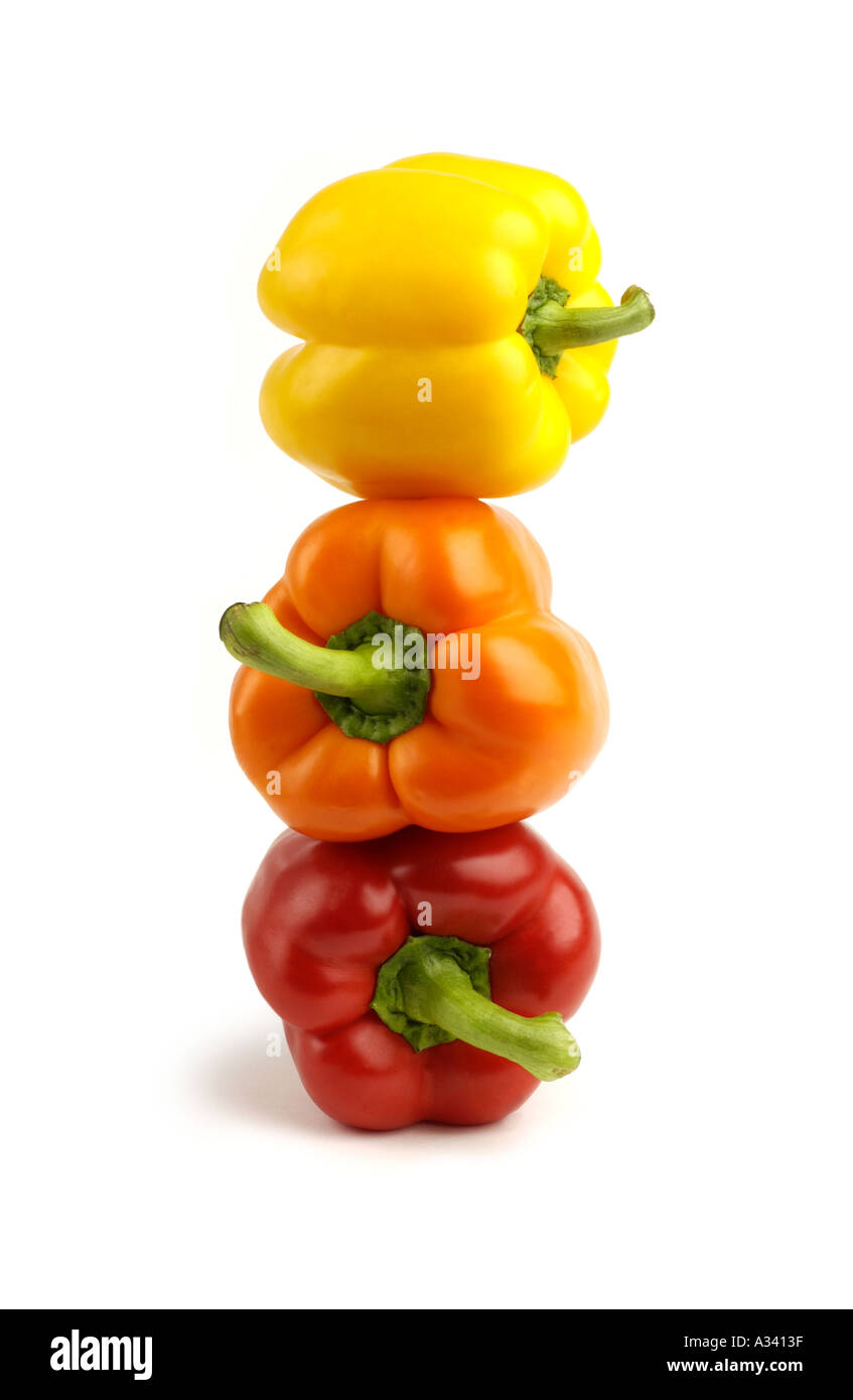 Stack of red orange and yellow bell peppers Stock Photo