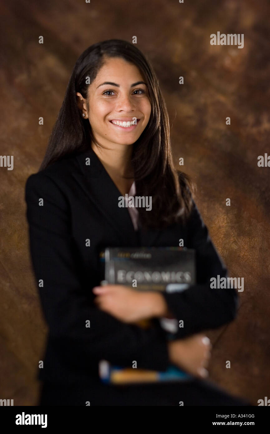 Portrait of a young African American woman holding school books Stock ...