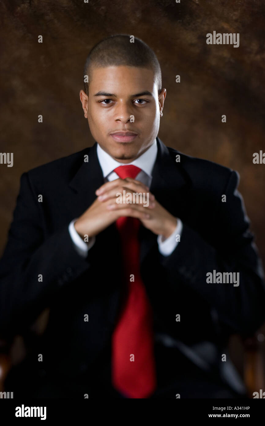 portrait of a young african american man in a suit Stock Photo - Alamy