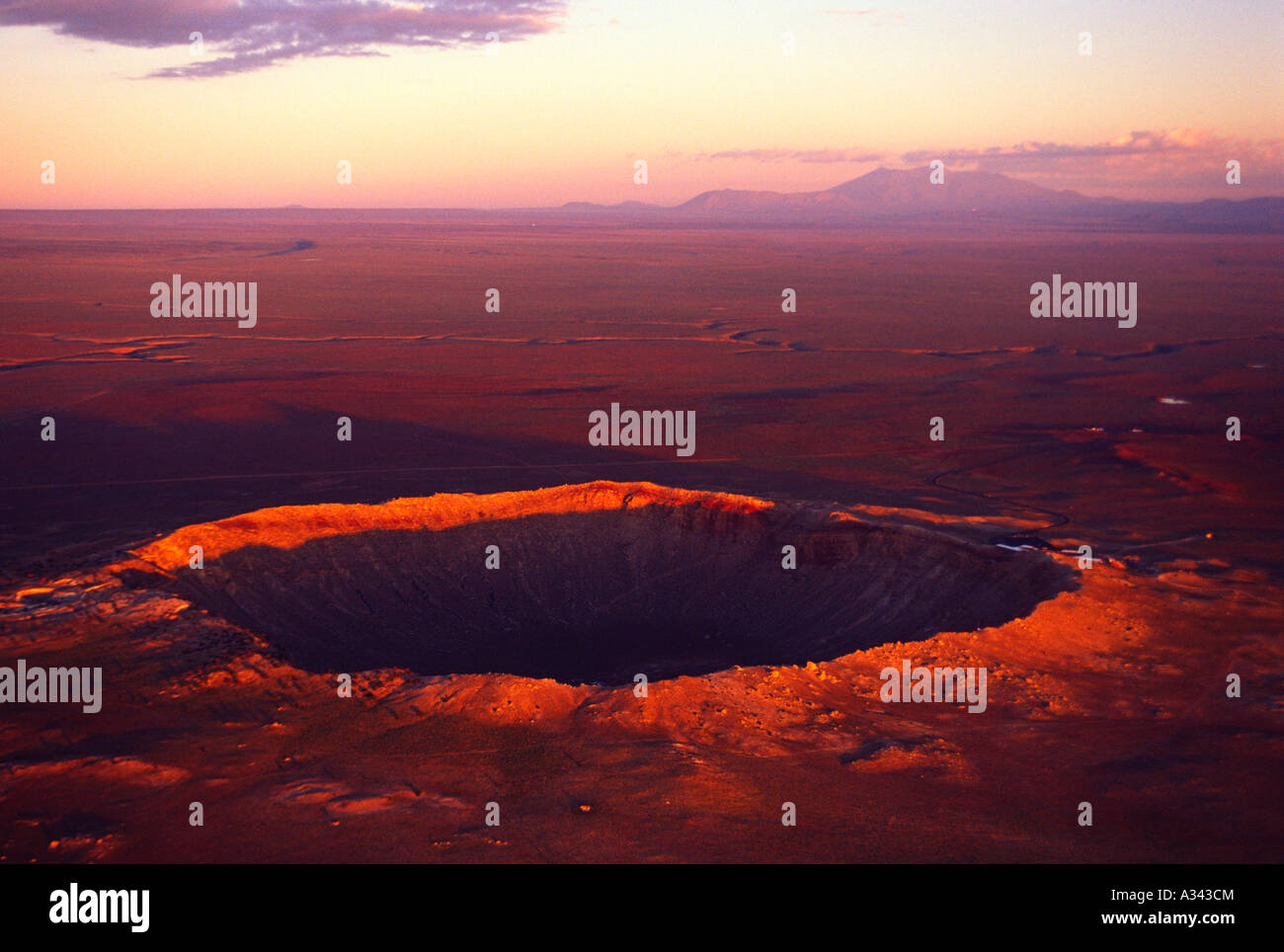Aerial view at sunrise of Meteor Crater and the San Francisco Peaks, Arizona. Stock Photo