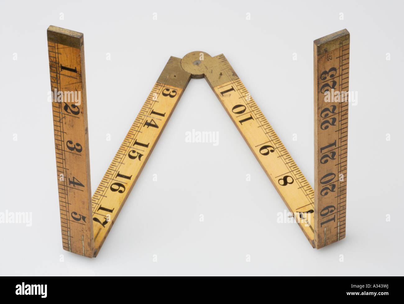 Folding wood measuring ruler Brass hinges Letter W Stock Photo Alamy