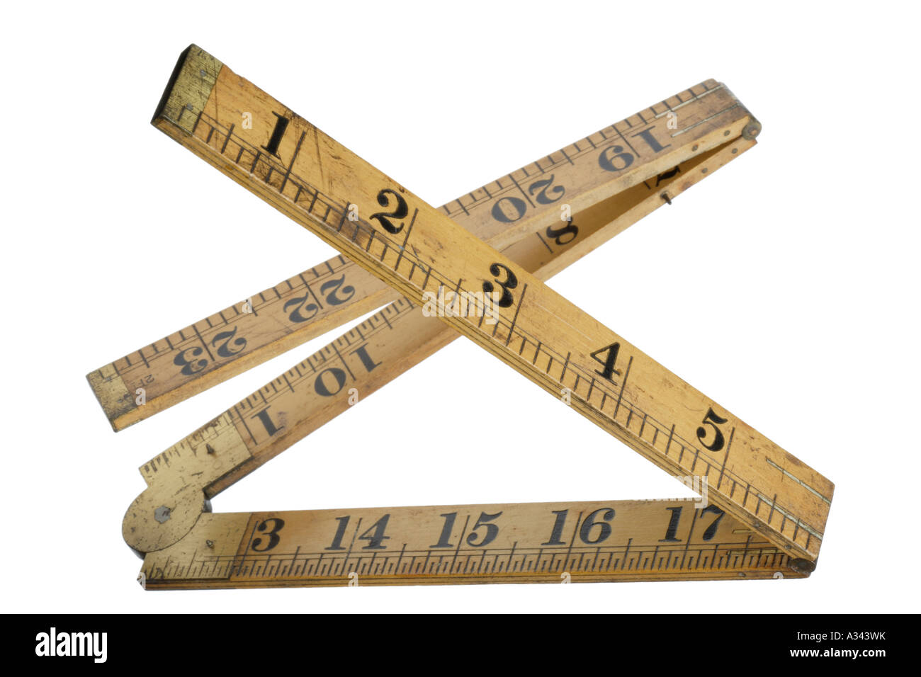 Folding wood measuring ruler Brass hinges Letter X Stock Photo