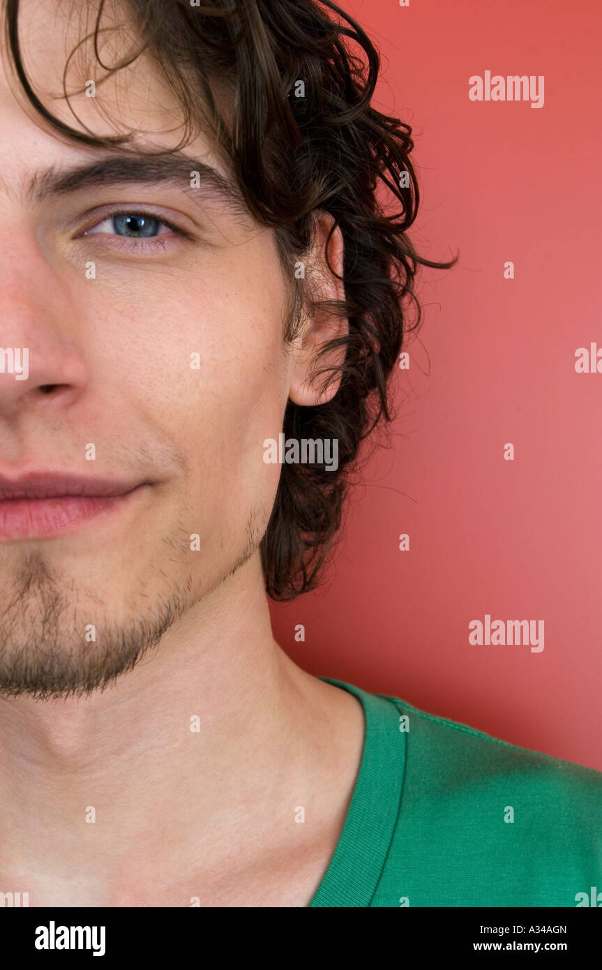 Portrait of a young man looking at the camera Stock Photo - Alamy
