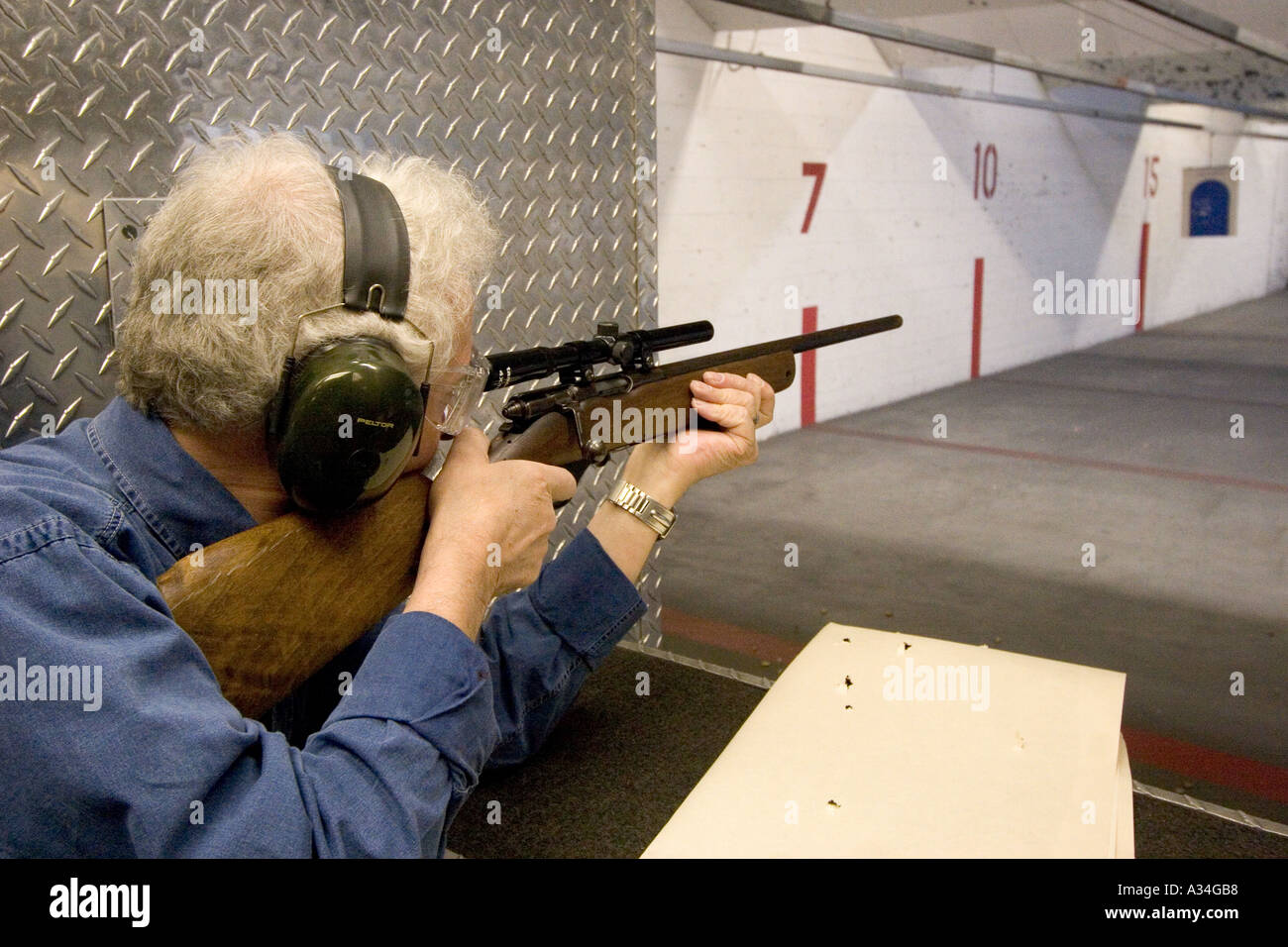 American indoor gun shooting range Male shooter at target practice Las Vegas Nevada Shooting gallery Stock Photo
