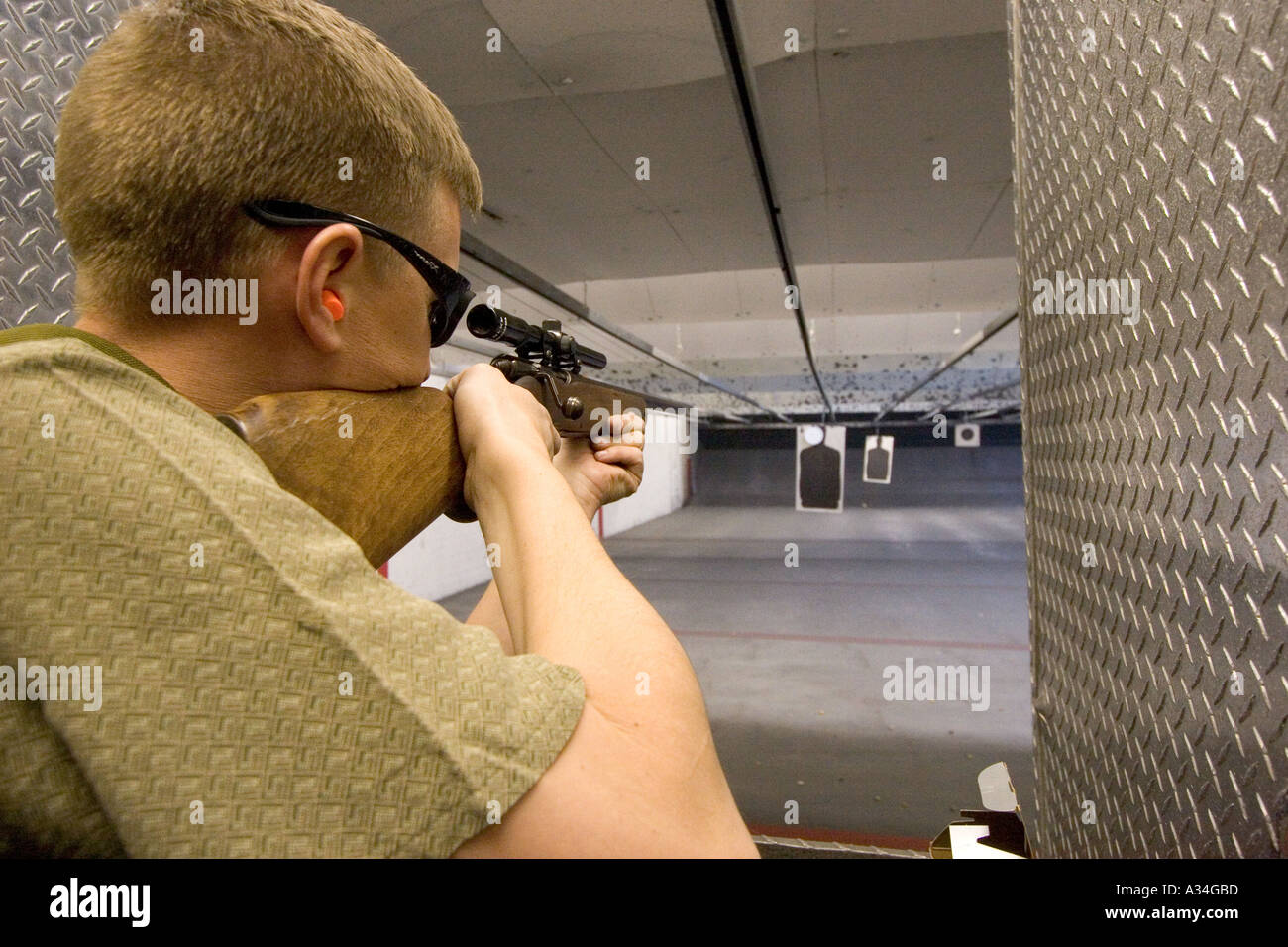 American indoor gun shooting range Male shooter at target practice Las