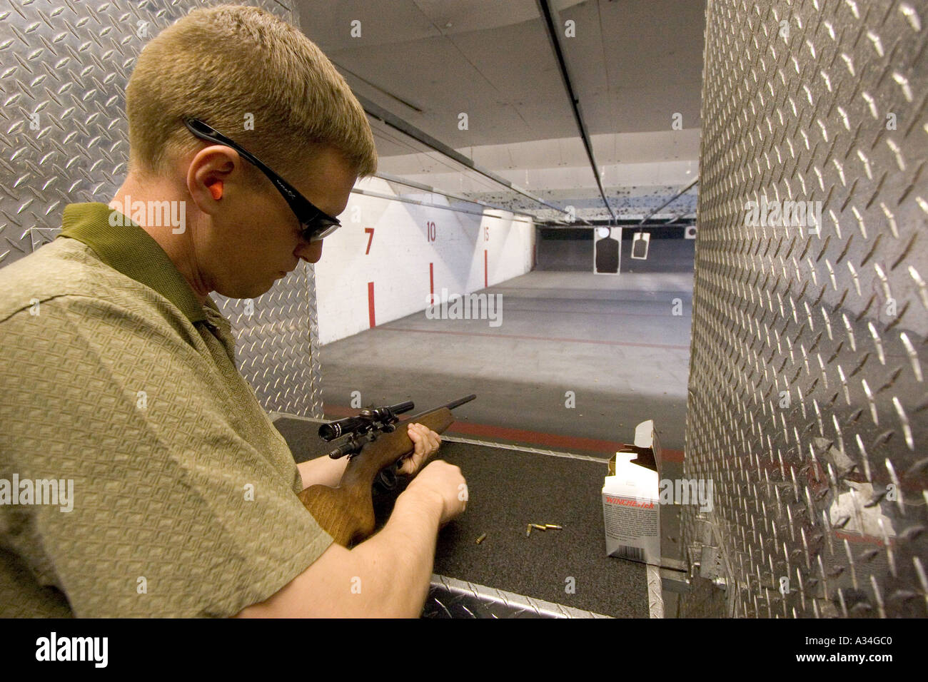 American indoor gun shooting range Male shooter at target practice Las