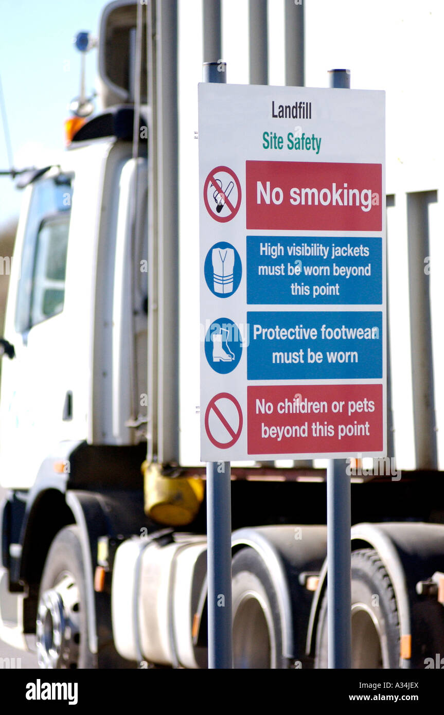 Royalty free photograph of lorry arriving at UK landfill site in London with warning signs at site Stock Photo