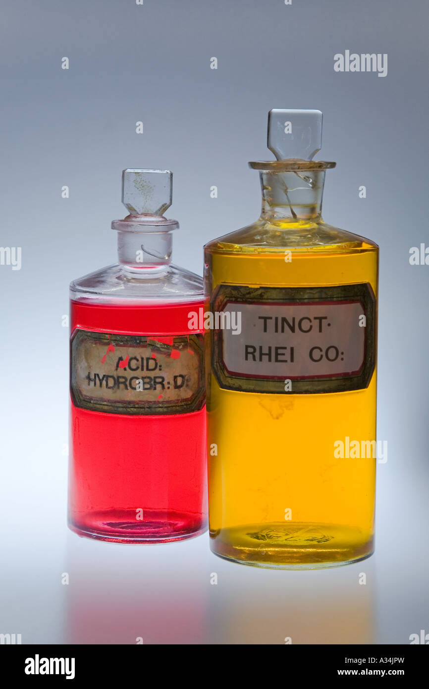 Coloured Liquid in Chemists glass stoppered Pharmacy Bottles