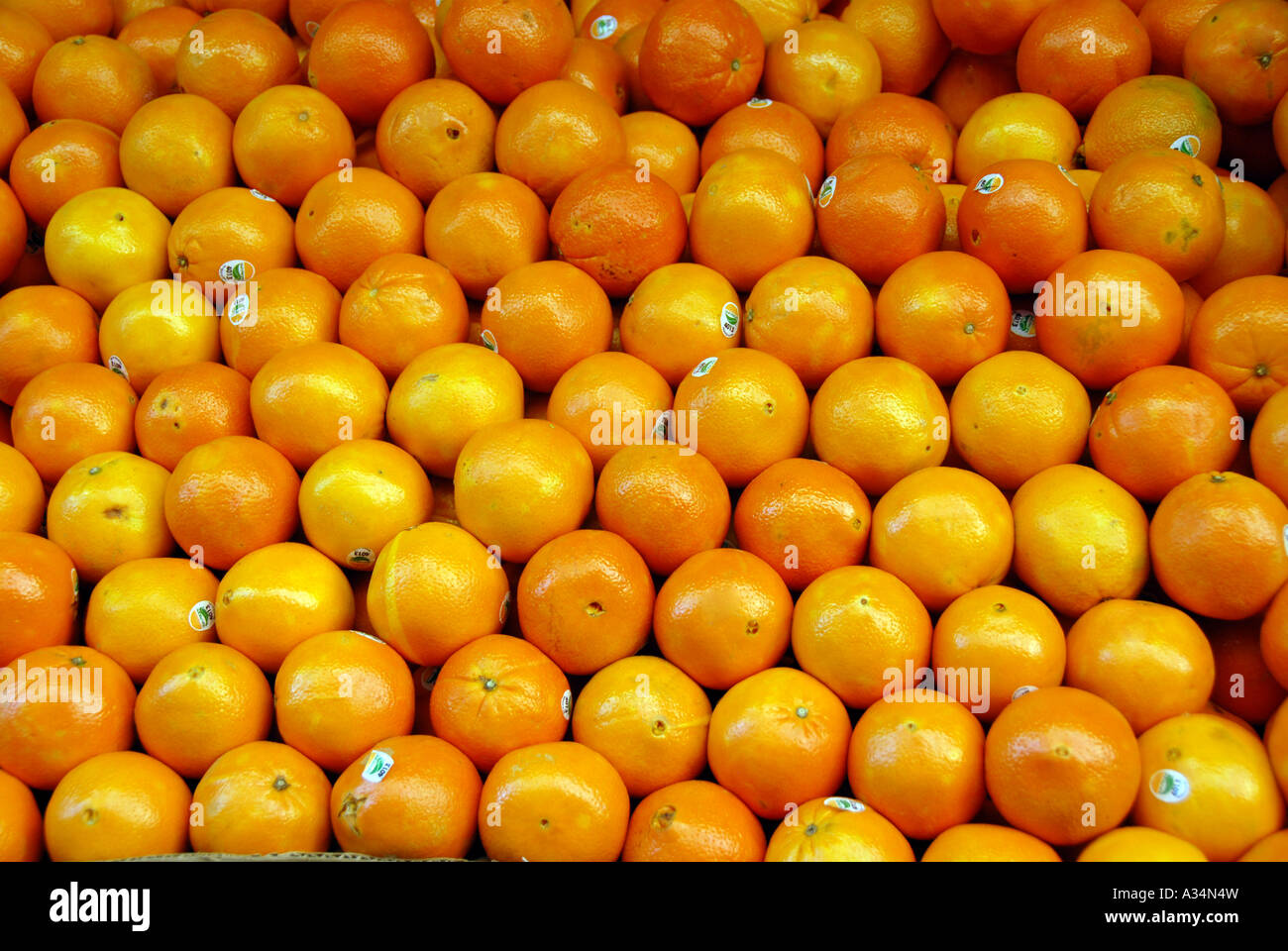 Oranges stacked in an outdoor fruit market display Stock Photo - Alamy