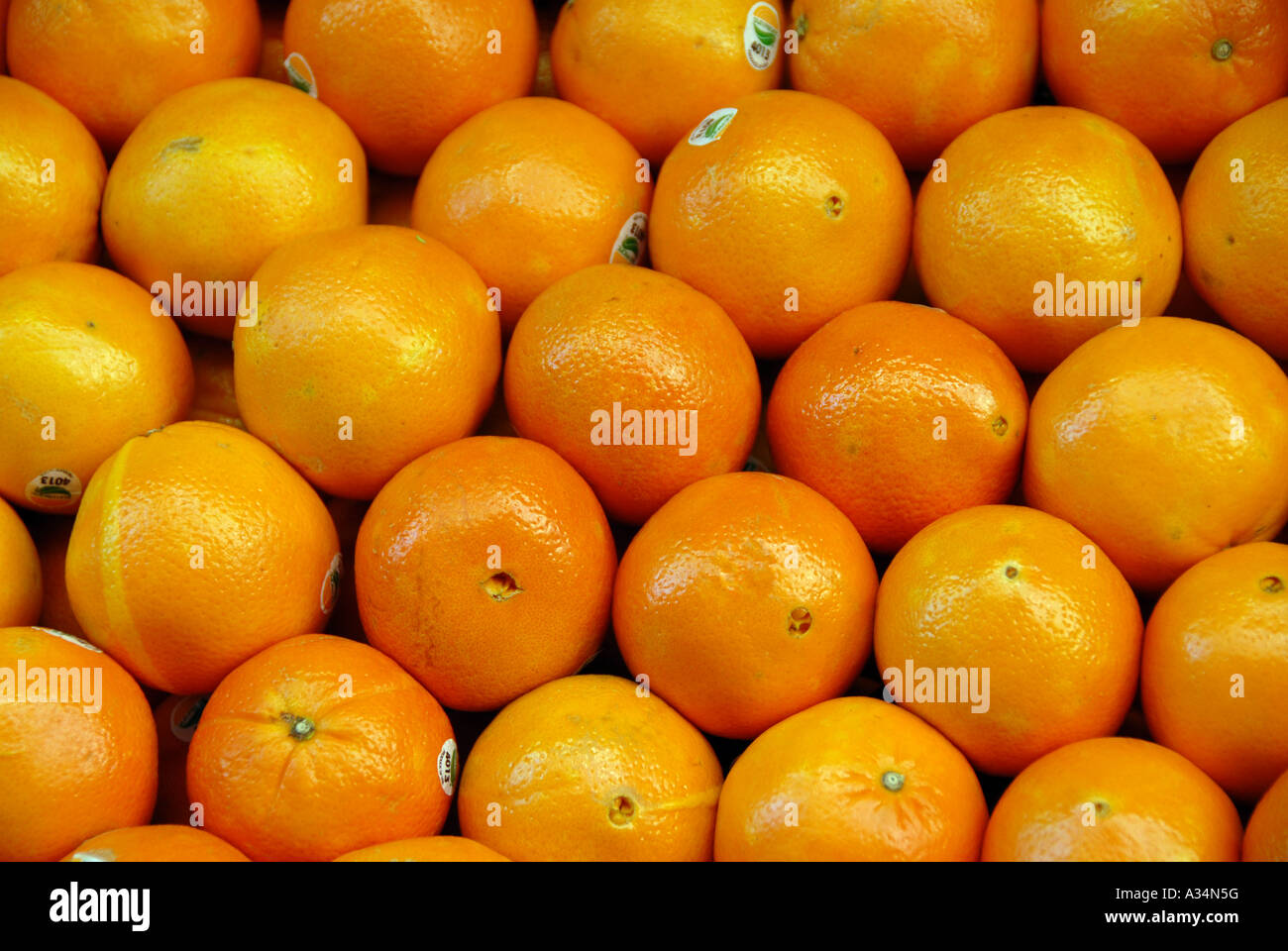 Oranges stacked in an outdoor fruit market display Stock Photo Alamy