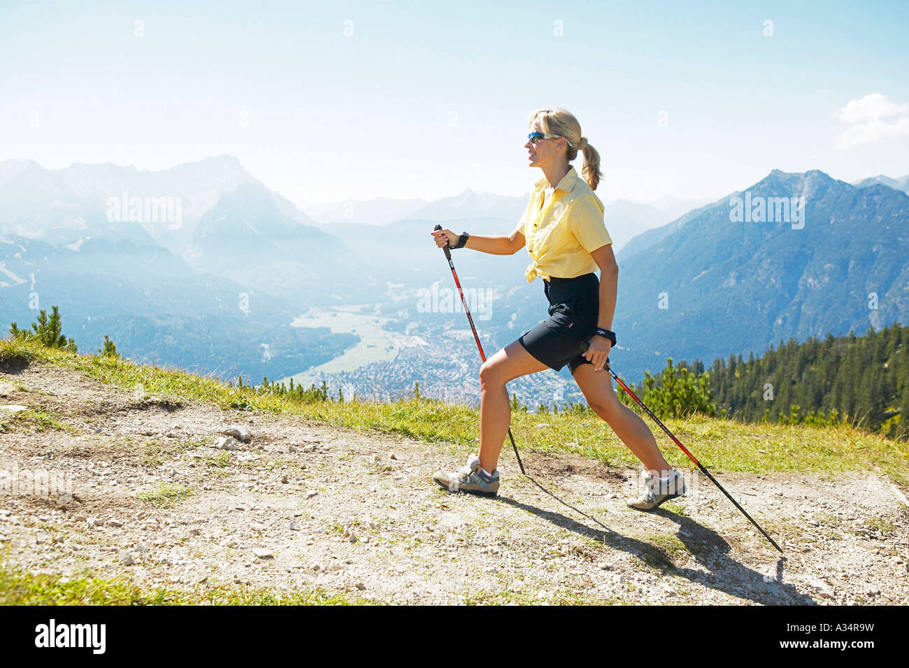 woman doing nordic walking, Frau beim Nordic Walking Stock Photo - Alamy