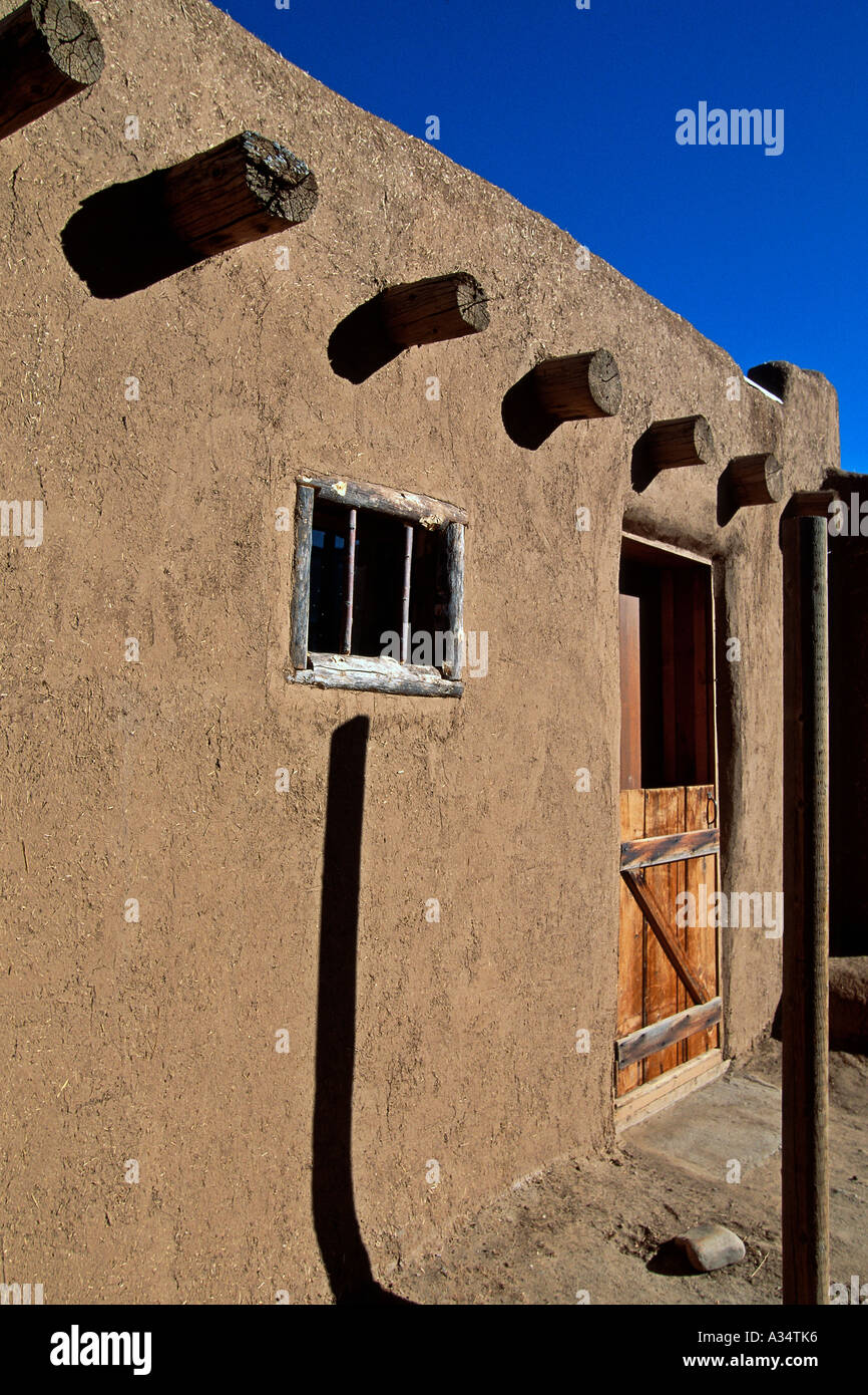 Mud adobe walls with timber Vigas supporting roof Taos Pueblo Taos New