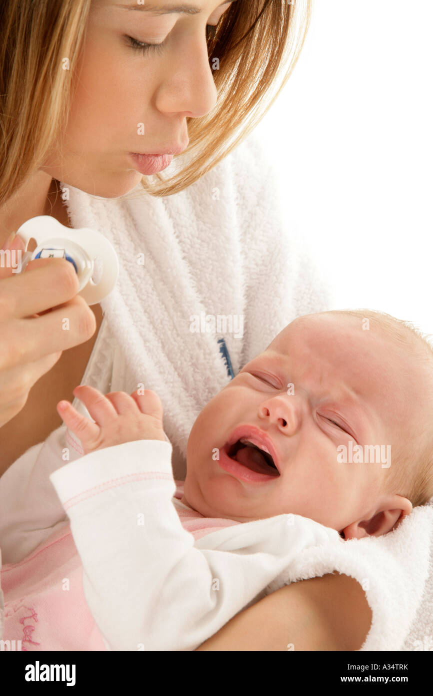 Mother Comforting Her Little Crying Baby Stock Photo 10670742 Alamy