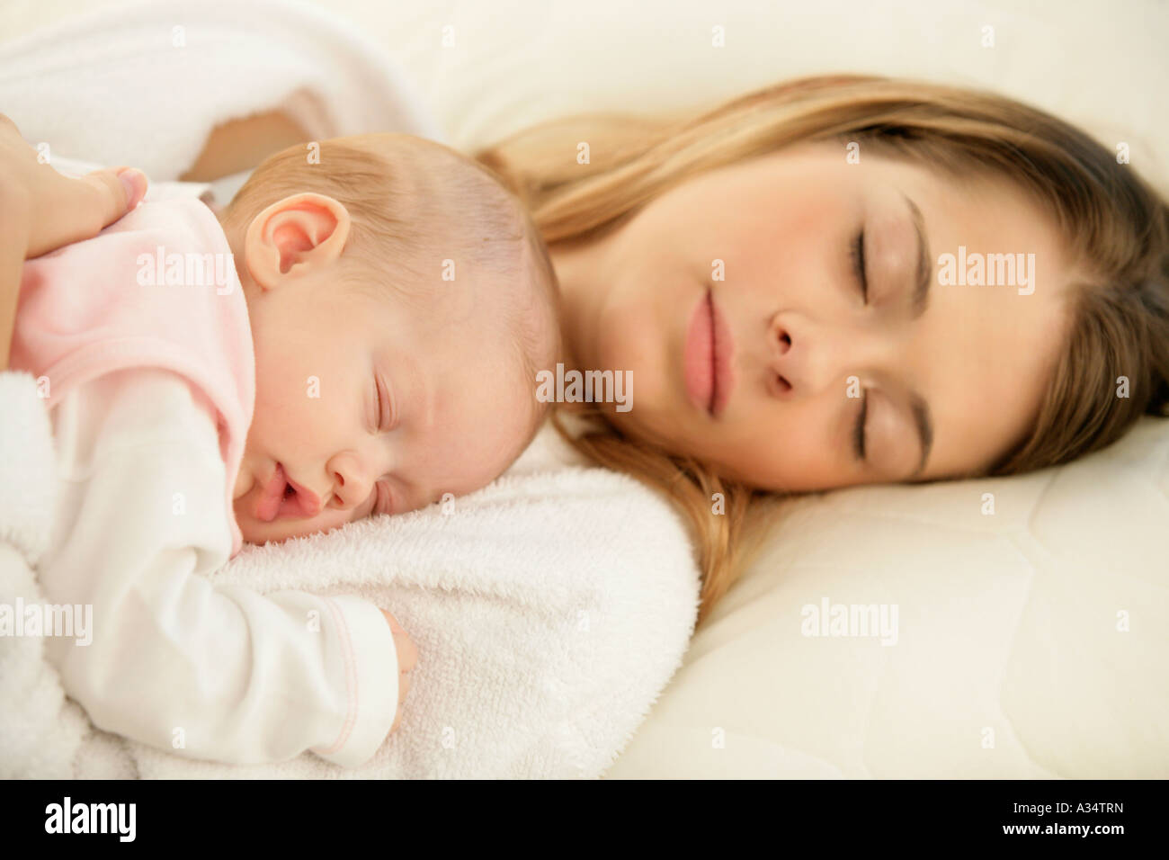 Mother with doughter sleeping on her chest Stock Photo Alamy