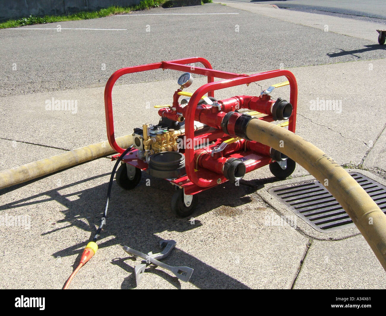 A hose pressure testing machine is hooked up to a firehose Stock Photo