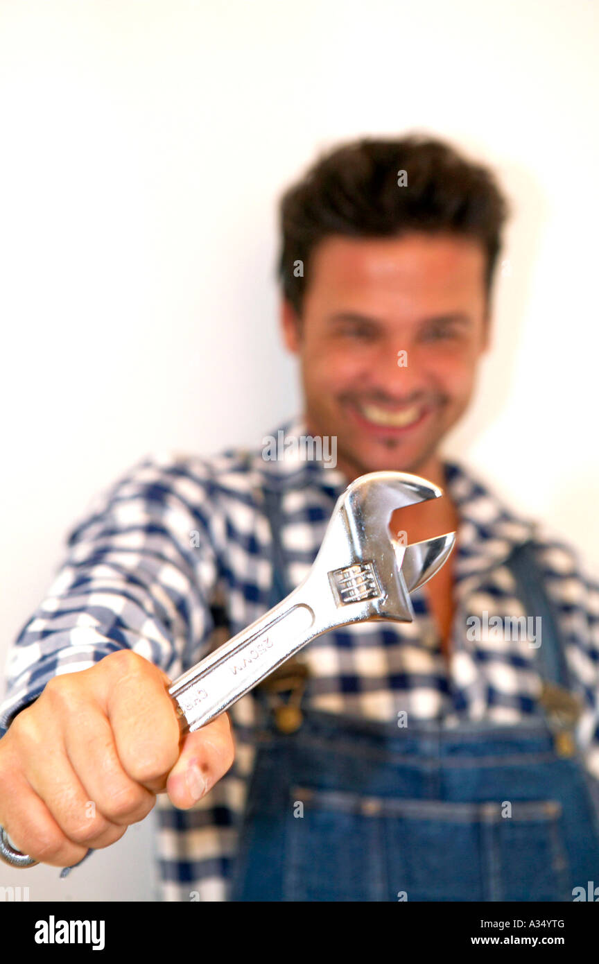 Handwerker mit Schraubenschluess, craftman with wrench Stock Photo