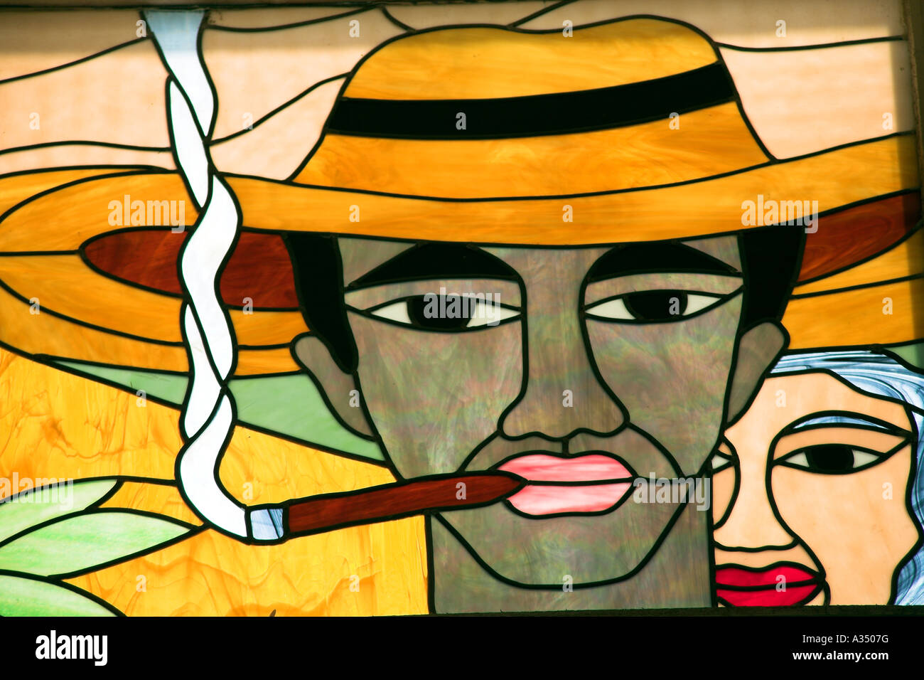 Colourful stained glass window of man smoking a cigar, Trinidad, Cuba