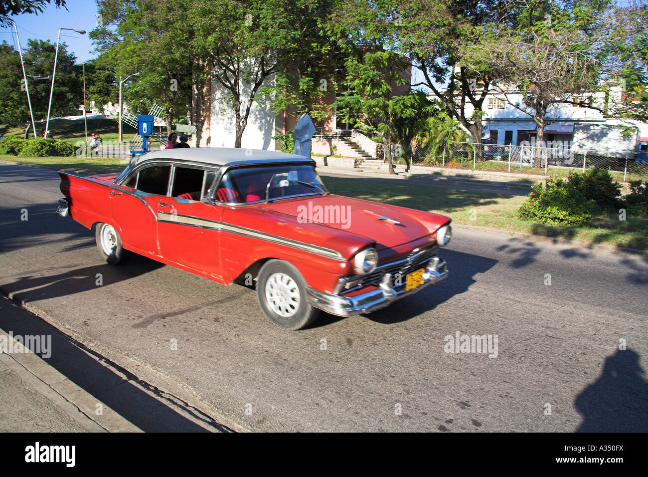 Classic brown car, being driven at speed, Santiago de Cuba, Cuba Stock Photo