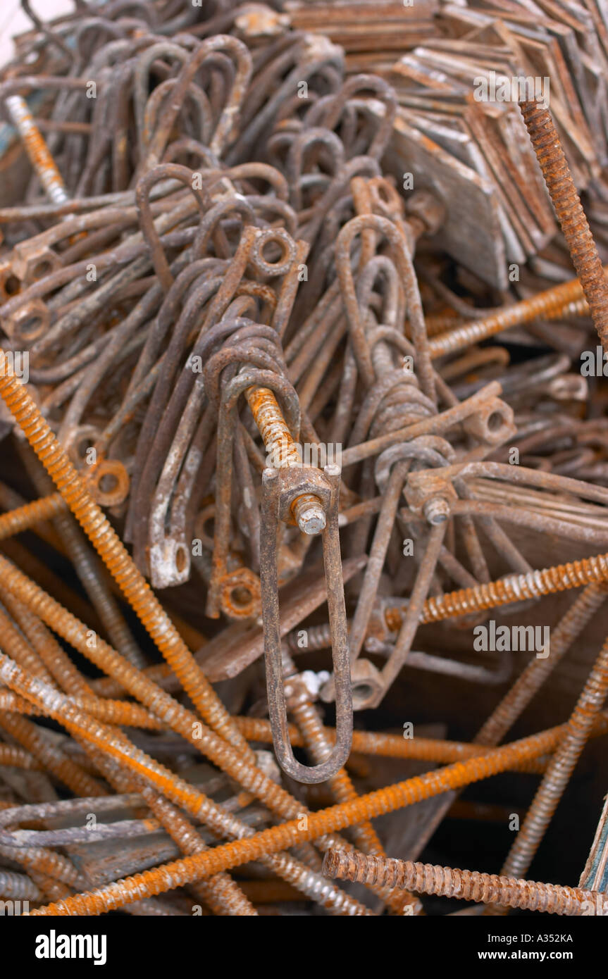 A pile of large industrial-size rusted pins. Stock Photo