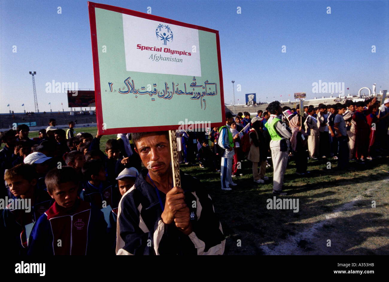 A disable athlete holds the SOA's banner during the  opening ceremony at Ghazi Stadium, Kabul. Stock Photo