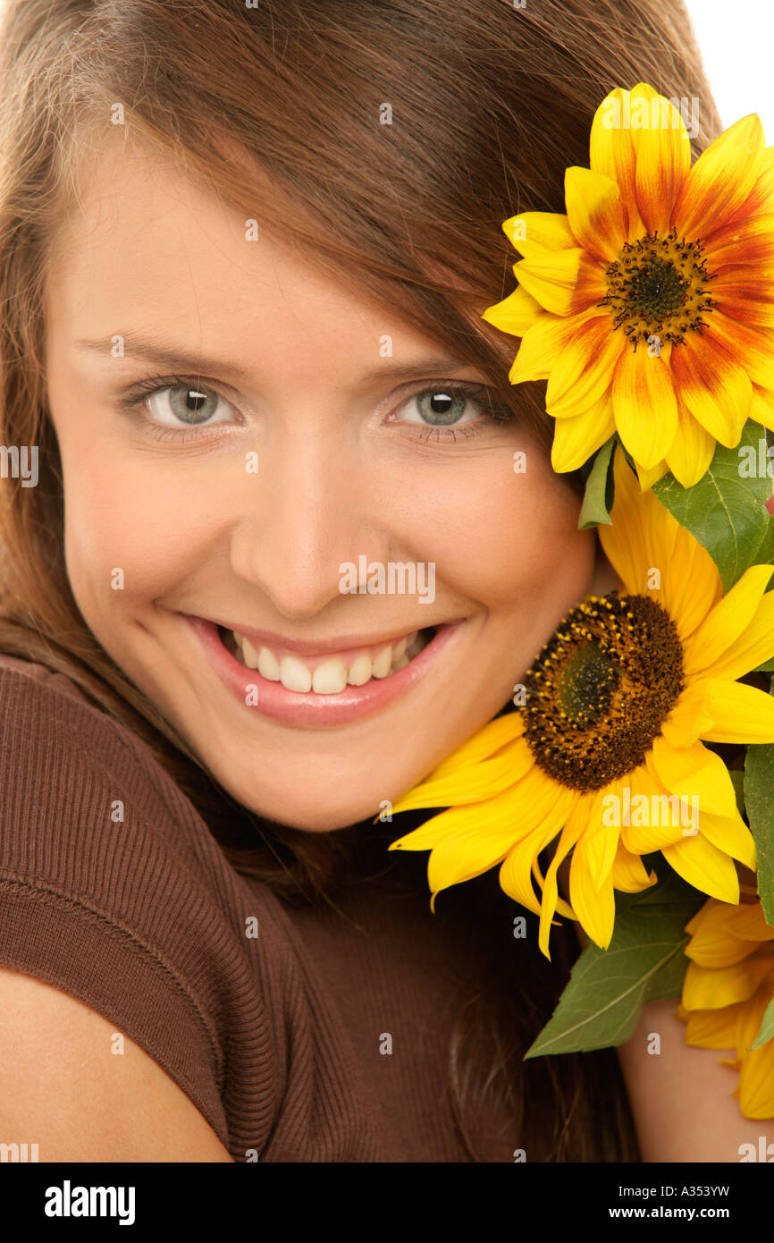Portrait of young woman with sunflowers Stock Photo - Alamy