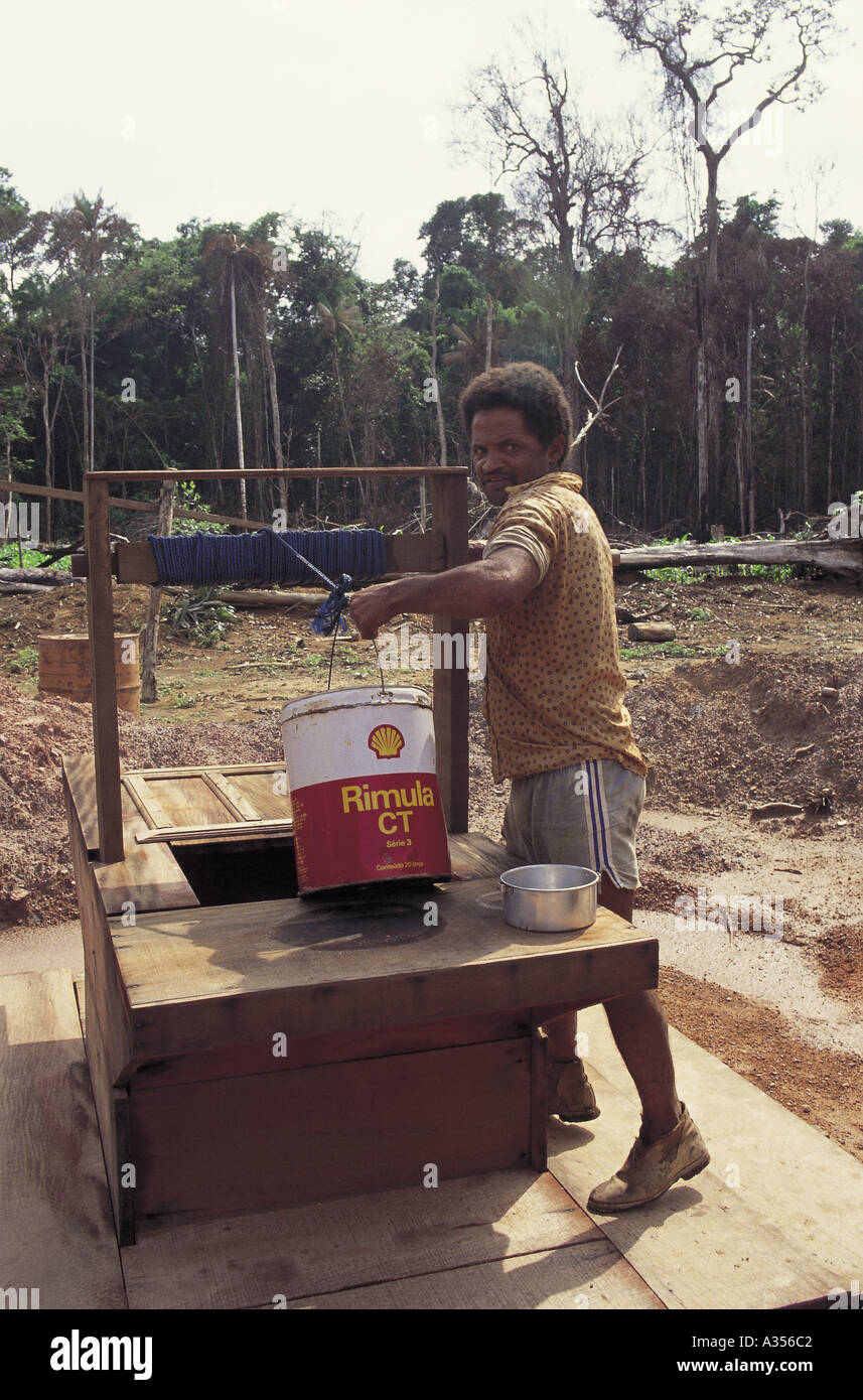 Juruena Brazil Settler getting water from a new well Stock Photo