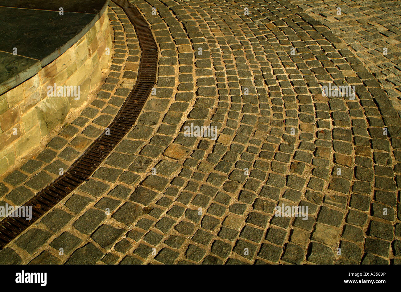 A bend in a cobblestone road in Europe Stock Photo Alamy