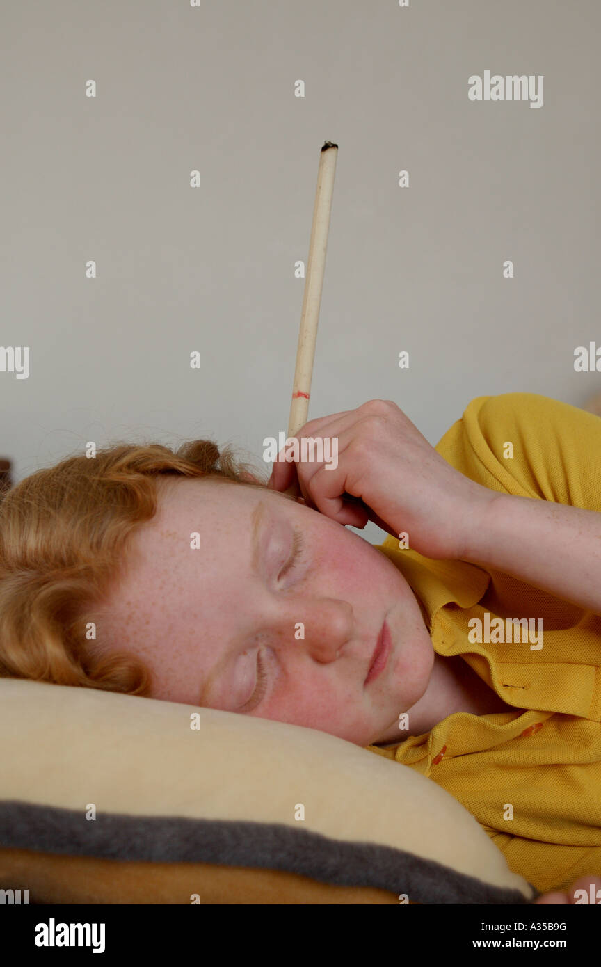 Hopi ear candle therapy Stock Photo Alamy