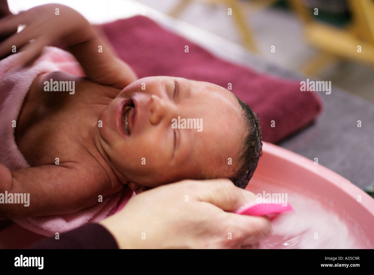 Baby First Bath Stock Photo