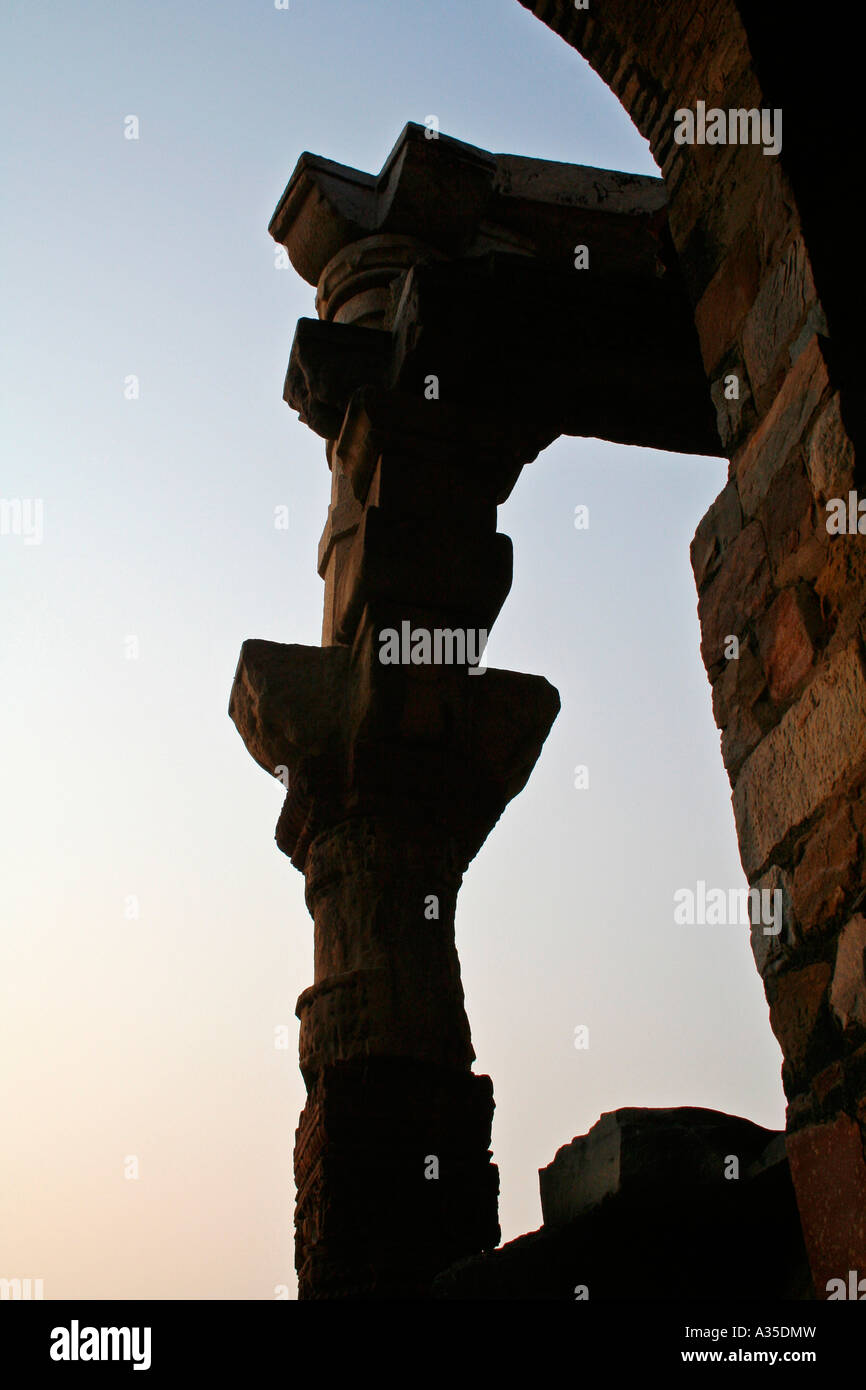 Arch and pillar at Qutb Minar complex viewed at sunset Stock Photo