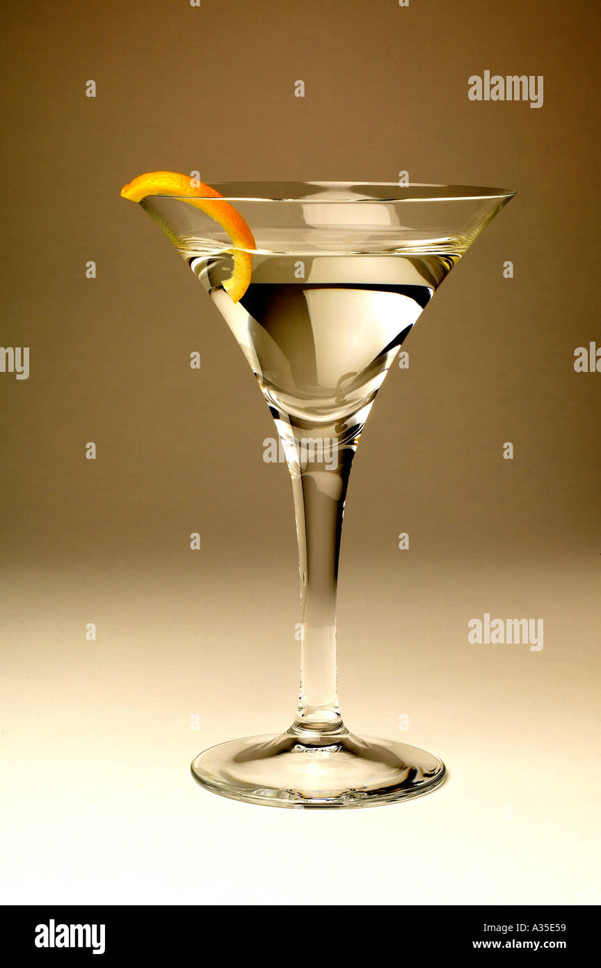 Vodka or gin martini glass with a peel of lemon rind Stock Photo Alamy