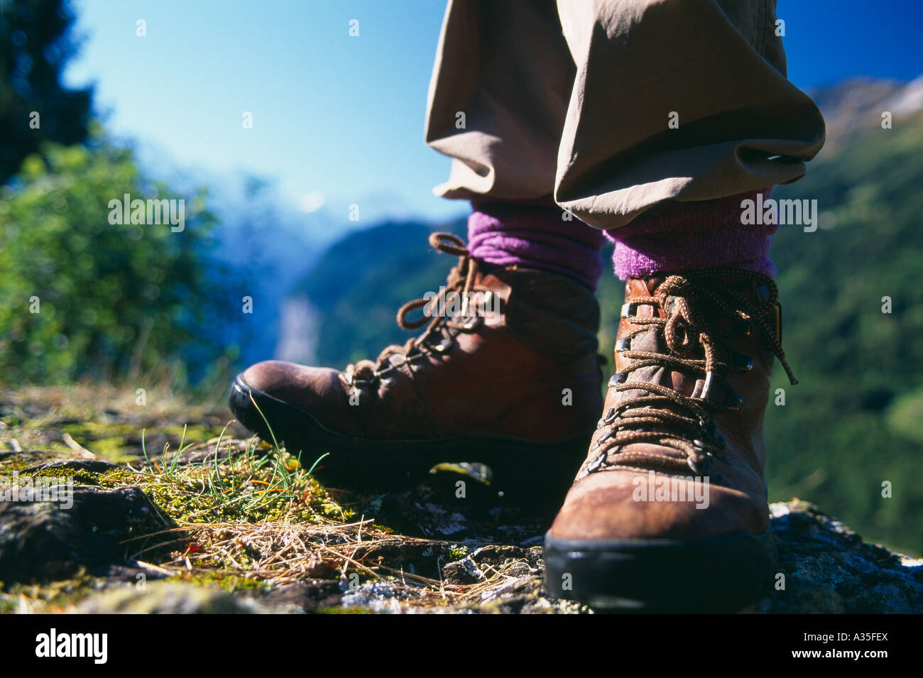 hiking boots with mountain landscape Bernese Oberland Switzerland Stock Photo Alamy