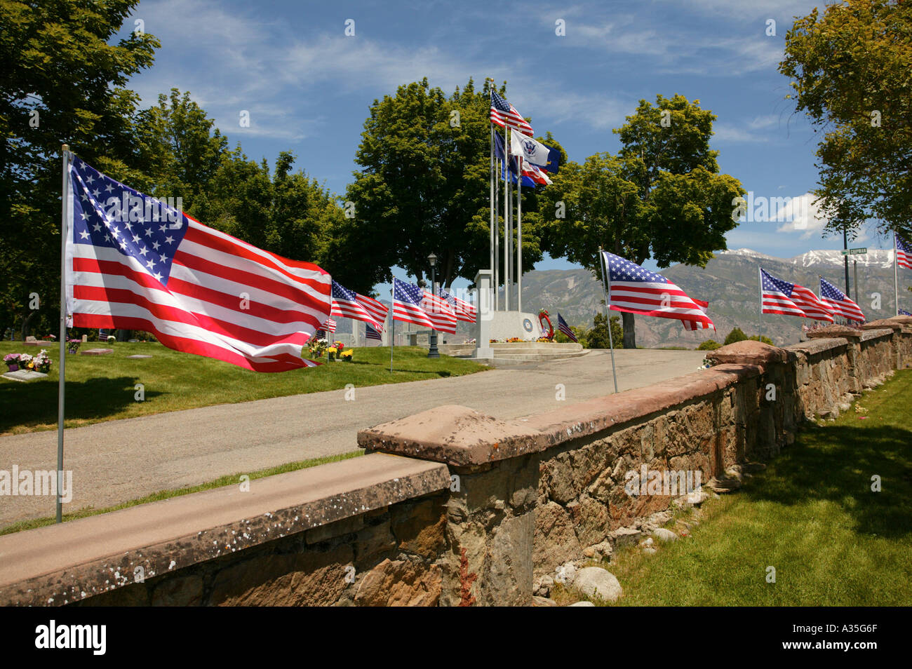 American flags blowing in the wind at a War Memorial in the American