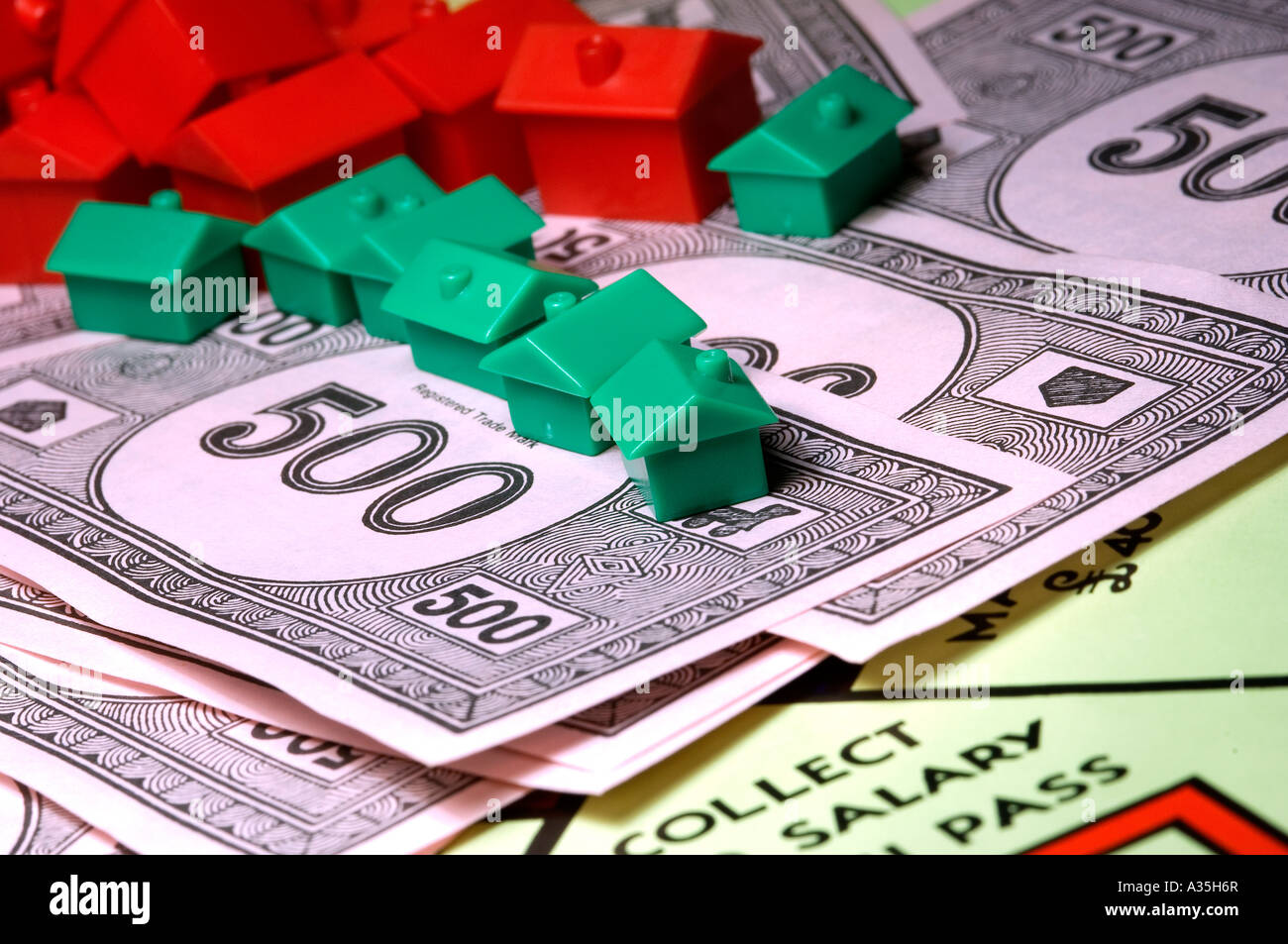 Close up of monopoly money and houses business concept cash note notes banknote banknotes Stock Photo
