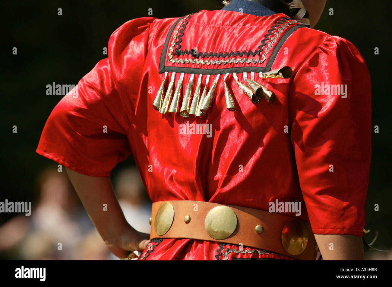 Back view of a red Native American dance costume with long bells Stock Photo