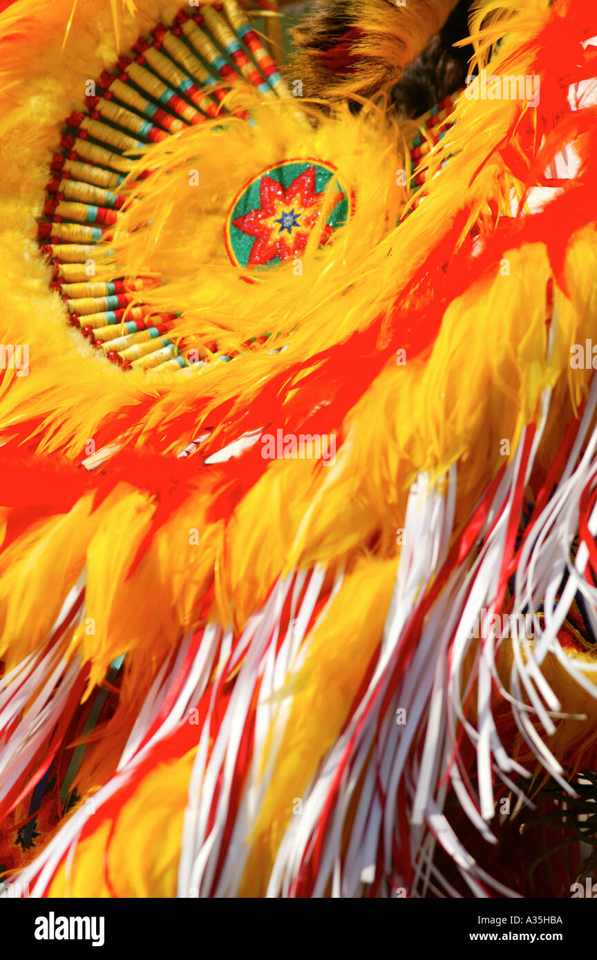 Native American dance costume with yellow and red feathers Stock Photo