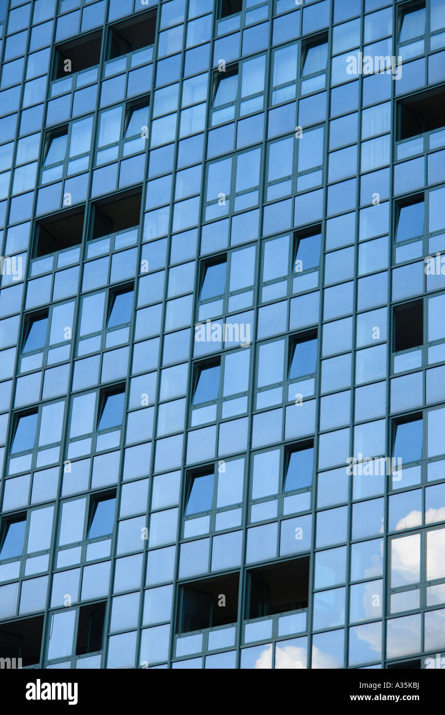 Clouds and sky reflecting in a modern office building Stock Photo - Alamy