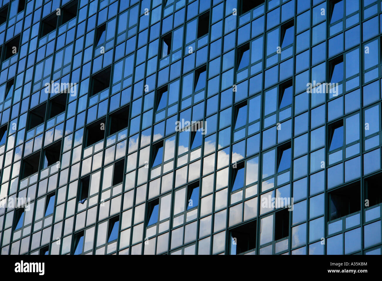 Clouds and sky reflecting in a modern office building Stock Photo - Alamy