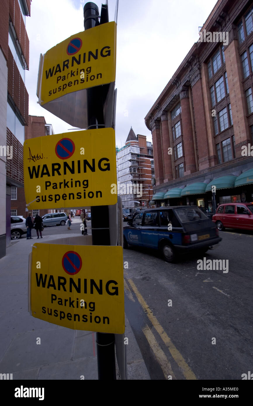 Warning parking suspension signs knightsbridge outside Harrods Stock
