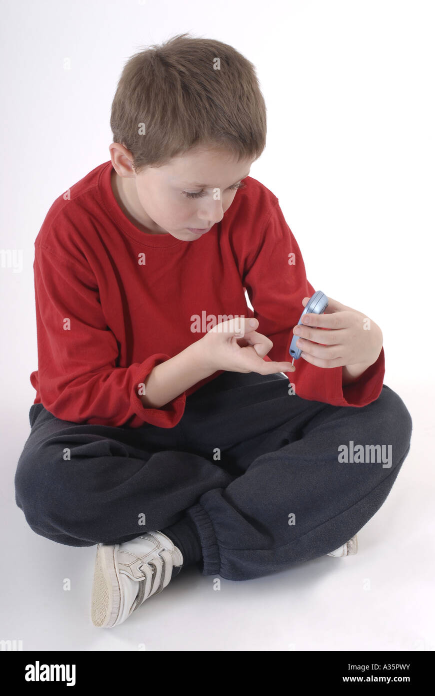 Young diabetic child testing his blood glucose level Stock Photo Alamy
