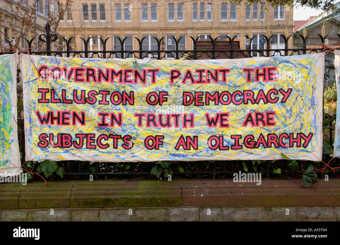 Protest banner by Cardiff political activist Crazy Dave hanging on a fence in Cardiff city centre South Wales UK Stock Photo
