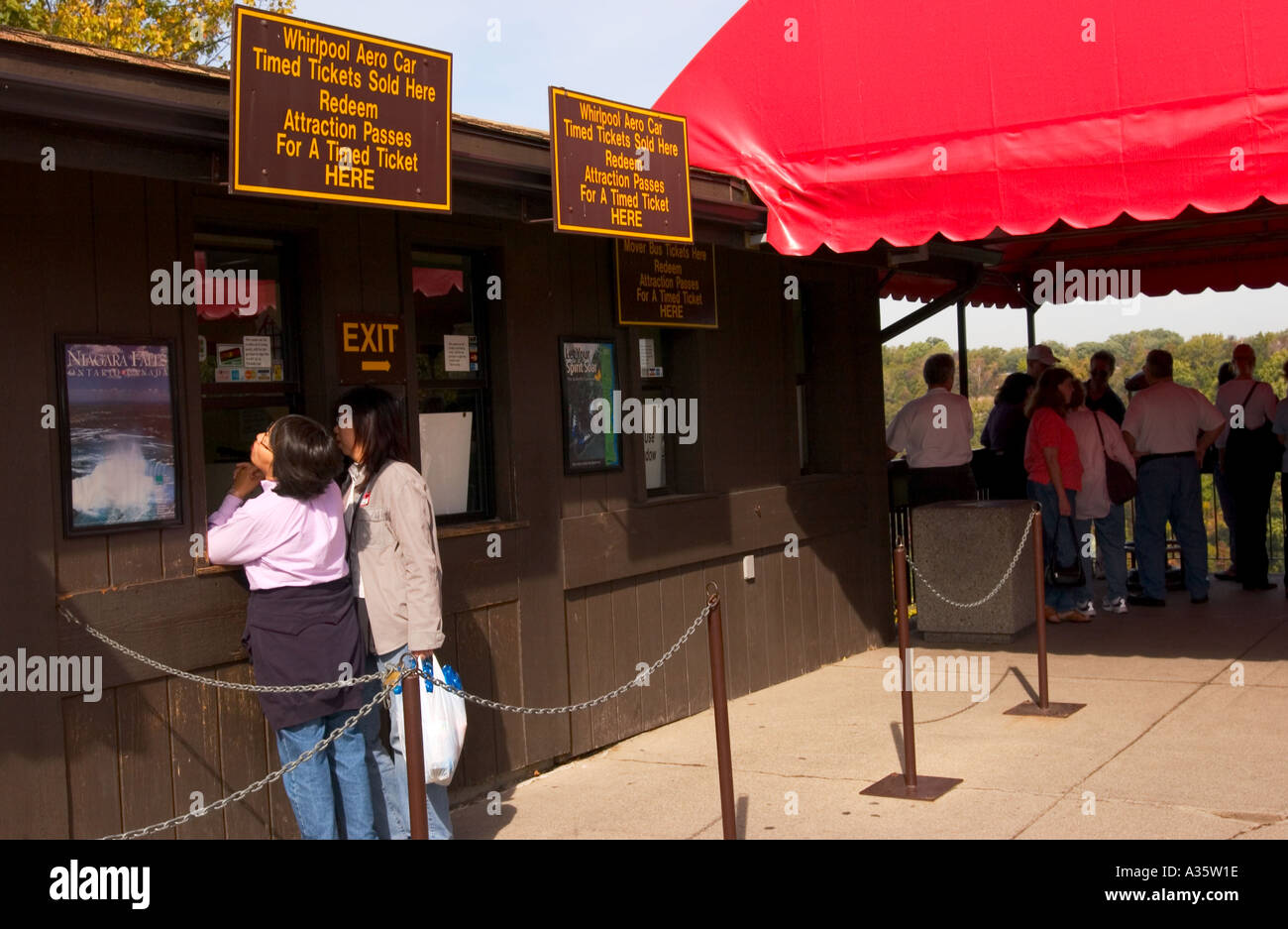 Stock Photo Show Two women buying tickets to ride cable car over