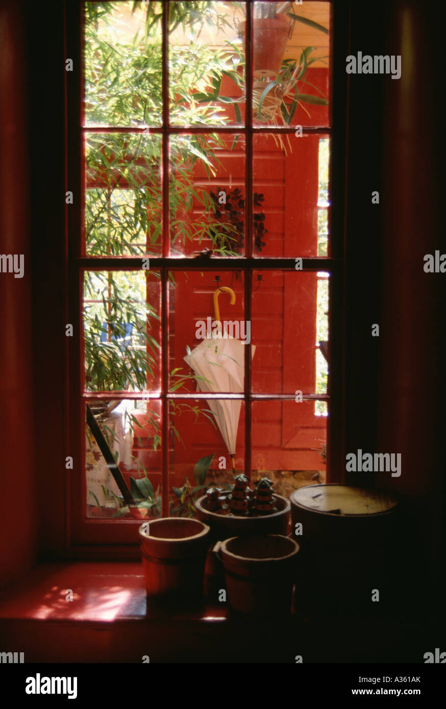 internal window with view into red hall Stock Photo - Alamy