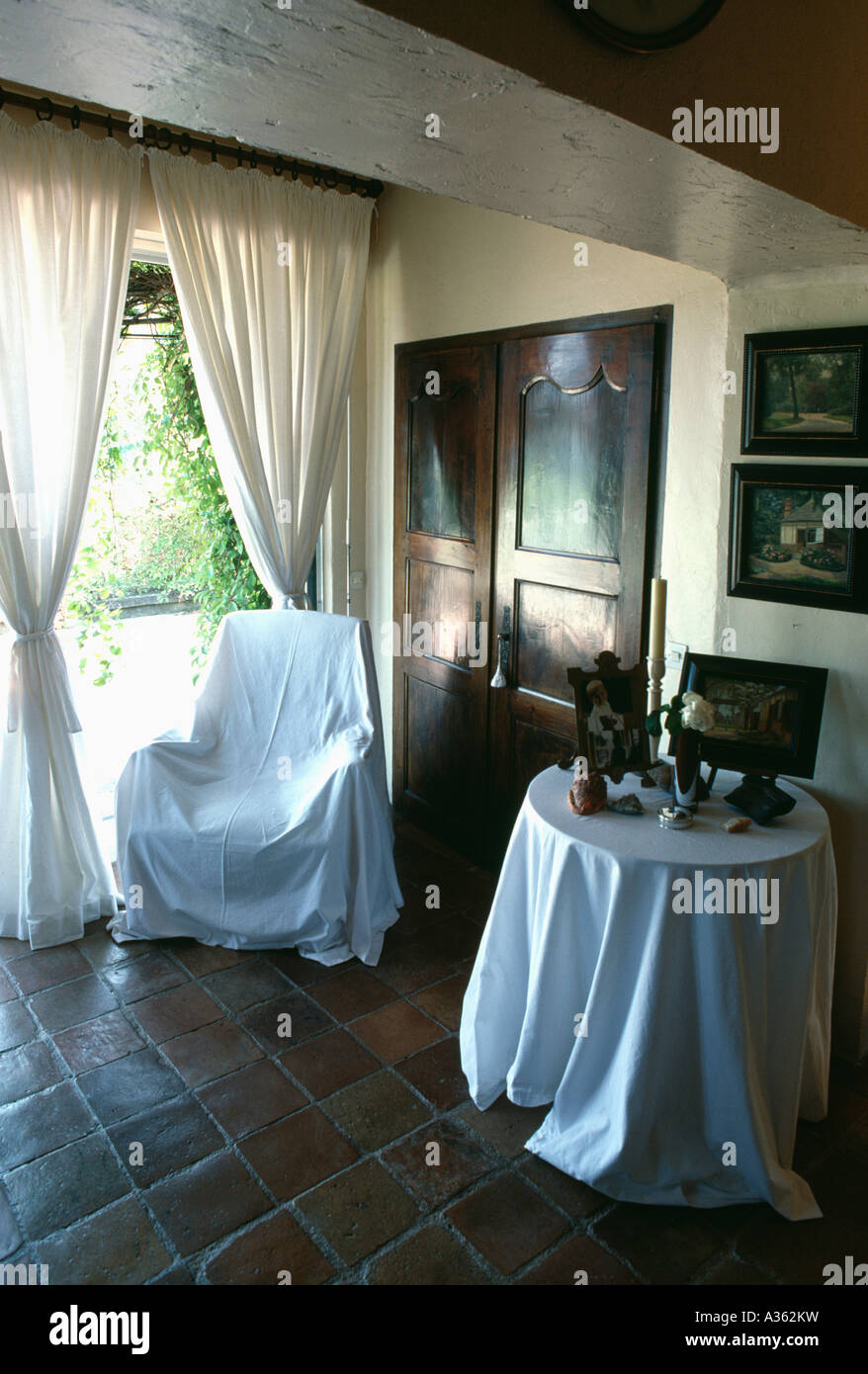 Chair With White Cotton Throw And White Cloth On Table In Country
