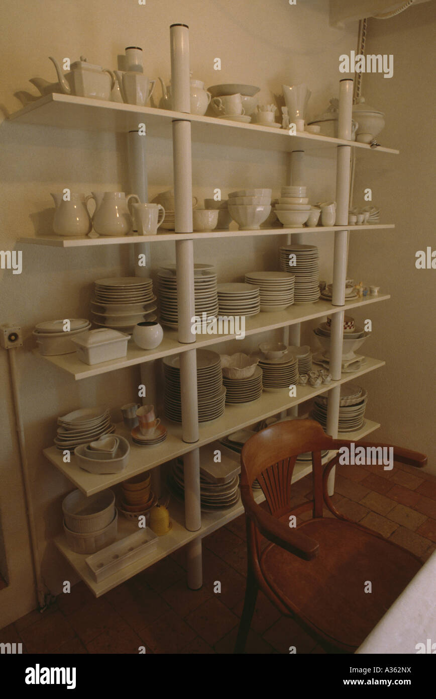 Collection of cream crockery on shelves Stock Photo Alamy