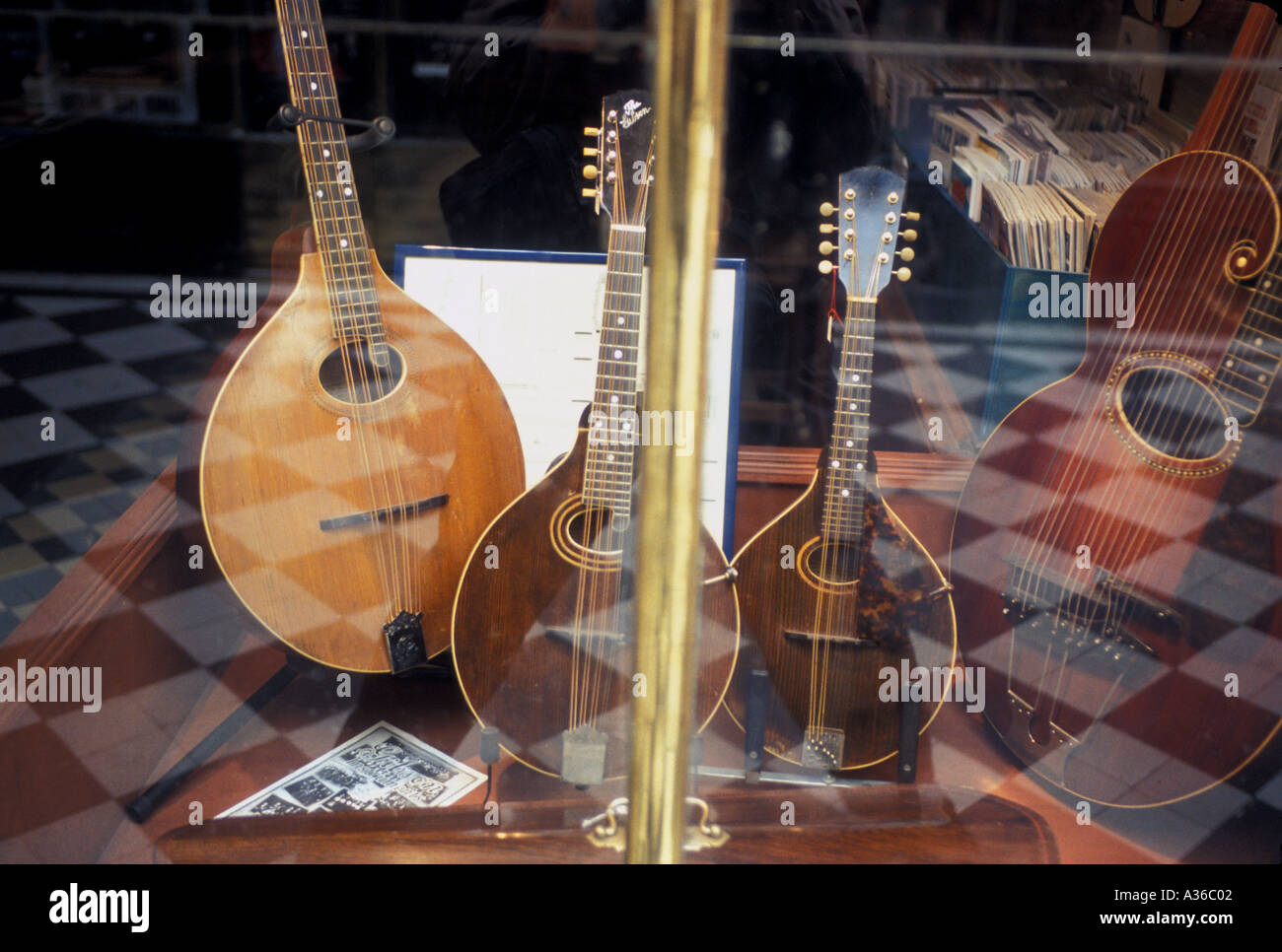 Stringed instruments in music shop window Stock Photo