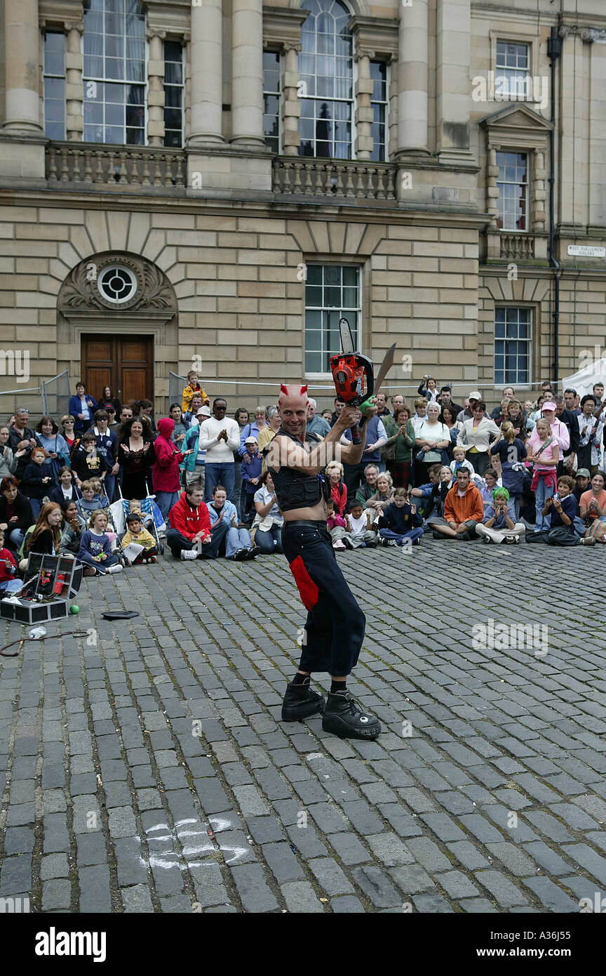 Chainsaw juggler hires stock photography and images Alamy